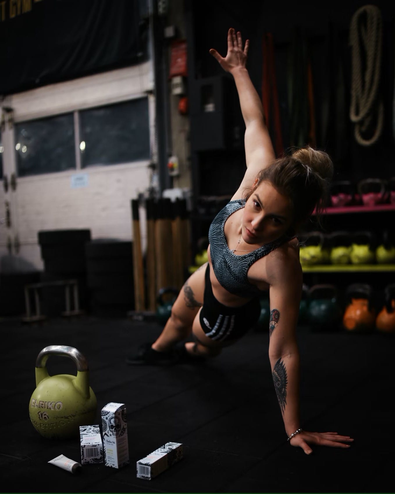 Women doing floor stretches in a gym