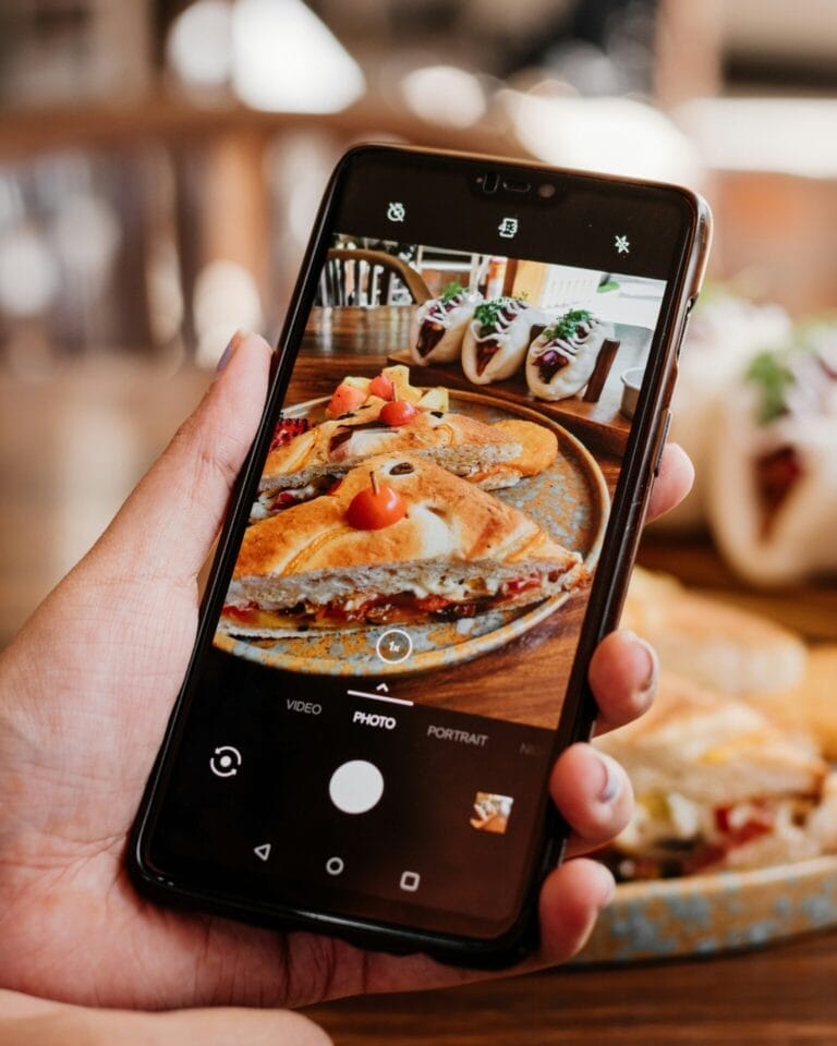 Food Blogger taking picture of meal