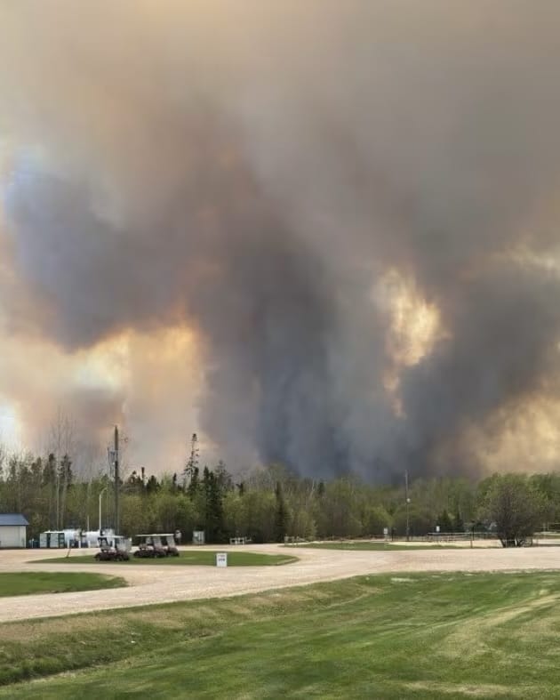 Lac du Bonnet Wildfire Forces Mass Evacuations Amid ‘Very Dark Day’ in Eastern Manitoba